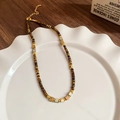 Macro detail of the tiger eye beads and golden spacers on a bohemian necklace - 34# Gold Brown Style
