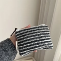 Close-up of hand holding black and white striped woven coin purse with simple wish label - Black and White Stripe Weave