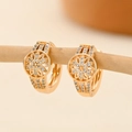 Macro detail of heart gold earrings with flower design and micro-paved cubic zirconia - EH230 Hollow Flower