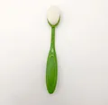 Oval makeup brush with vibrant green handle and soft white sponge head for base makeup - Green
