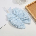 Elegant light blue pleated bow hair clip with faux pearls for women in a lifestyle setting - Sky Blue