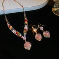 Detail showing gold necklace and earrings with pink heart gems and colorful square stones - 17# Necklace-Gold-Multi-color