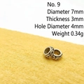 Macro detail of vintage silver spacer bead with size specs 7mm diameter and 4mm hole - Size 9