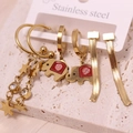 Three-pair gold stainless steel earring set with star charms, elephants, and snake chains - Style 1
