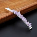 Detailed close-up of a metal hairpin featuring natural purple crystal gravel on wood - Lavender Amethyst with Silver Clip