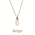 Detail of handmade beige woven rope net pouch necklace with a brown wooden bead - Beige