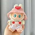 Labubu plush toy wearing pink corduroy hat with love heart and checkered overalls - Pink And White Checkered Overalls Romper + Red Heart Pink Hat / First And Second Generation Keychains Are Compatible With La Cloth Dolls. Dolls Not Included.