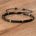 Adjustable black emperor stone beaded bracelet with golden spacers on wood background - No.52 Black Imperial