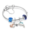 Macro detail of ocean theme charm bracelet with blue octopus and shell charms - A3 / 17cm