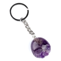 Purple natural stone bear paw keychain with silver metal ring on white background - Amethyst