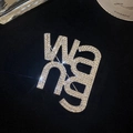 Luxurious silver Wang letter brooch with sparkling crystals on black velvet background - Large Letter Brooch - Silver
