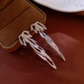 Close-up of silver tassel earrings with crystal leaves on a velvet jewelry box - Wing Leaf Ear Drops (Silver Needle) / Silver