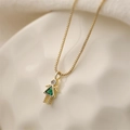 Golden necklace featuring a cute mini girl pendant with a green triangle gemstone and zircon - May Green