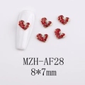 Detailed view of red rhinestone heart nail charms with gold metal base on white tips - AF28-Gold Base Red Rhinestone Heart