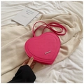 Rose pink heart-shaped backpack featuring rich rabbit lettering and metallic logo - Pink