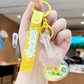 Guitar shaped liquid quicksand keychain with yellow lemon slices and glitter decor - Fruit Violin - Lemon