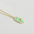 Golden necklace with mint green hexagonal bee pendant and crescent moon charm - Green