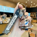 Astronaut keychain featuring a blue guitar space man in a liquid UFO bottle with strap - UFO Astronaut - Guitar