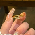 Luxurious gold-plated H-shaped ring with pavé cubic zirconia worn on female hand - H Letter Shape / Gold