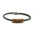 Macro shot of green leather bracelet featuring golden cylinder metal bead with filigree - Gold H