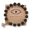 Black lava stone beaded bracelet featuring a gold Evil Eye charm with crystal accents - 19cm / Lava Stone