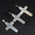 Translucent white crystal cross pendant with black cord necklace and metal bails - Agate