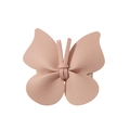 Detail shot of a small pink bow hair clip featuring premium synthetic leather texture - Light Pink