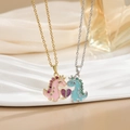 Detail of magnetic dinosaur heart necklaces with pink and blue enamel and crystals - Dinosaur Love Heart