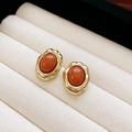 Elegant gold earrings with oval orange-red gemstone studs on a beige display cushion - Silver Earring Post Irregular Oval Orange Red Gemstone Stud Earrings (25#)