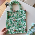 Detailed close-up of a floral cotton handbag featuring a vintage bronze metal snap button - Dark Green Base Flower(T-29)