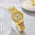Detail of luxury gold watch with diamond-encrusted band and blue hands on silver background - Gold