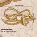 Elegant gold bow brooch with sparkling crystals and white pearl, size 4.5cm x 2.8cm - Gold Bowknot Pearl (BRS-J438G)