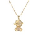 Detailed view of a gold-plated bear pendant with a cap and pink and white zircon stones - Pink