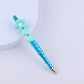Detailed view of DIY blue beaded pen featuring turquoise silicone flower and decorative beads - Mint Green