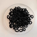 Set of seamless black high-elasticity hair ties presented on a glass tray - Black 100Pcs OPP Bag