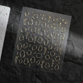 Detailed view of 3D metallic gold nail stickers featuring abstract liquid and irregular shapes - Foil Stamping