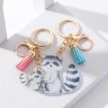Detail of acrylic raccoon pendants with gold keychains and colorful decorative tassels - Acrylic Raccoon Parent-Child Pendant 1 Pair