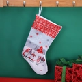 Christmas stocking with Nordic gnome and reindeer pattern on red and white fabric - White Background Pattern Sock