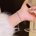 Elegant adjustable gold chain bracelet featuring colorful rhinestones on a female wrist - S478 Gold