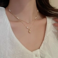Close-up of double-layer gold necklace with baroque pearls worn by a model - 33# Necklace - Golden Bean (2-piece Set) With Real Gold Plating