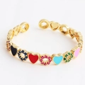 Gold open bangle featuring colorful enamel hearts and sparkling zircon accents - Heart Multi-color