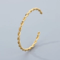 Minimalist golden C-shape twisted stainless steel cuff bracelet on a neutral grey background - Style A Twisted Rope Texture (KB184848-KFC) / Gold