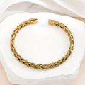Elegante bracciale rigido aperto a treccia dorato in acciaio inossidabile lucido - Oro