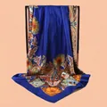 Detail of navy blue silk scarf featuring vintage orange paisley floral patterns - Navy Blue