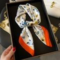 Elegant floral silk scarf with blue and yellow flower prints on white base with orange borders - Orange