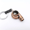 Llavero de turbocompresor de bronce con aspas giratorias y correa de cuero negro - Cobre