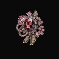 Vintage gold brooch with a large red oval gem and pink flower crystals on black background - XD825151-1 Gold Red
