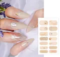 Macro detail of nude floral nail wraps with fine glitter and 3D wave patterns for manicure - YS-001 (Beige Shell Gold Foil)