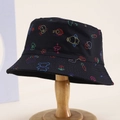 Kids black bucket hat with colorful animal graffiti print and puppy text on wooden stand - Black / 54cm (3-8 Years)