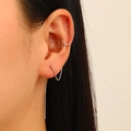 Close-up of heart-shaped ear cuff and long tassel box chain earrings with zircon accents - Silver Heart Ear Cuff with Chain